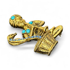 Vintage Hattie Carnegie snake charmer brooch with turquoise cabochons and blue rhinestones, gold tone metal, signed with copyright mark, 1960s figural costume jewelry.