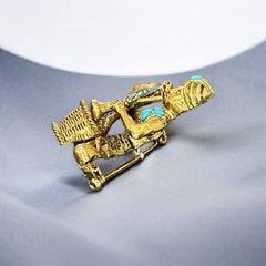 Vintage Hattie Carnegie snake charmer brooch with turquoise cabochons and blue rhinestones, gold tone metal, signed with copyright mark, 1960s figural costume jewelry.