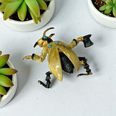 Signed Hattie Carnegie vintage bug brooch with yellow enamel coat, black top hat, turquoise cabochons, and gold-tone details—whimsical mid-century costume jewelry
