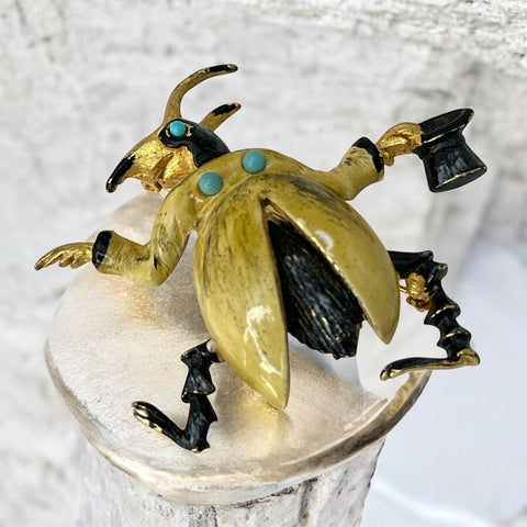 Signed Hattie Carnegie vintage bug brooch with yellow enamel coat, black top hat, turquoise cabochons, and gold-tone details—whimsical mid-century costume jewelry