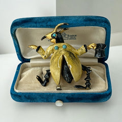 Signed Hattie Carnegie vintage bug brooch with yellow enamel coat, black top hat, turquoise cabochons, and gold-tone details—whimsical mid-century costume jewelry