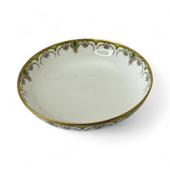 Antique Haviland Limoges France porcelain serving bowl with three gold spherical feet, ornate rim featuring floral and scroll motifs in blue, green, red, and gold; white base with maker’s marks “Haviland France” and “Haviland & Co Limoges”; very good vintage condition with one small factory flaw in center