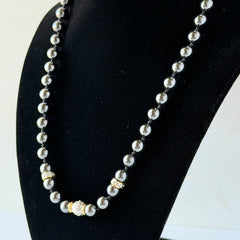 Vintage hematite bead necklace with gold‑tone and silver‑tone accents, hand‑knotted with slide ball clasp.