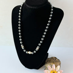 Vintage hematite bead necklace with gold‑tone and silver‑tone accents, hand‑knotted with slide ball clasp.