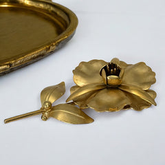 Vintage 1965 Hobé goldtone large flower brooch with dimensional petals, textured leaves, and a hidden locket compartment.