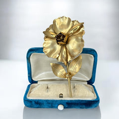 Vintage 1965 Hobé goldtone large flower brooch with dimensional petals, textured leaves, and a hidden locket compartment.