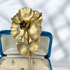 Vintage 1965 Hobé goldtone large flower brooch with dimensional petals, textured leaves, and a hidden locket compartment.