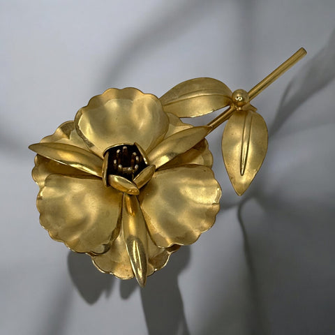 Vintage 1965 Hobé goldtone large flower brooch with dimensional petals, textured leaves, and a hidden locket compartment.