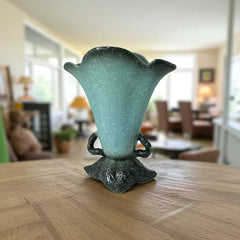 Vintage Hull Pottery vase with scalloped rim, aqua and speckled green glaze, double handles, and flared silhouette, photographed to highlight its mid-century design and glossy ceramic finish.
