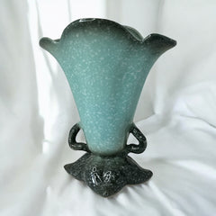 Vintage Hull Pottery vase with scalloped rim, aqua and speckled green glaze, double handles, and flared silhouette, photographed to highlight its mid-century design and glossy ceramic finish.