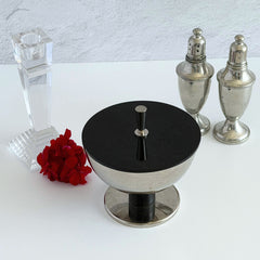 Vintage signed Igi nickel‑plated brass and black plastic modernist candy dish with lid, shown from multiple angles including signature underside.