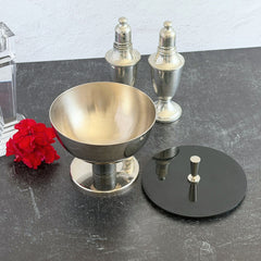 Vintage signed Igi nickel‑plated brass and black plastic modernist candy dish with lid, shown from multiple angles including signature underside.