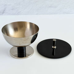 Vintage signed Igi nickel‑plated brass and black plastic modernist candy dish with lid, shown from multiple angles including signature underside.