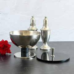 Vintage signed Igi nickel‑plated brass and black plastic modernist candy dish with lid, shown from multiple angles including signature underside.