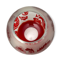 Vintage Illuminations frosted glass candle holder with etched red Spanish lace leaf pattern, rose bowl shape, softly glowing surface ideal for holiday decor or cozy ambiance.