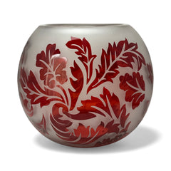 Vintage Illuminations frosted glass candle holder with etched red Spanish lace leaf pattern, rose bowl shape, softly glowing surface ideal for holiday decor or cozy ambiance.