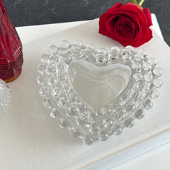 Vintage Imperial clear glass Candlewick heart-shaped dishes in a set of three, shown in various arrangements for decorative or serving use.