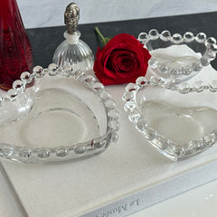 Vintage Imperial clear glass Candlewick heart-shaped dishes in a set of three, shown in various arrangements for decorative or serving use.