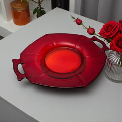 Vintage Imperial Glass Ruby Red Molly serving dish with hexagonal shape, twin handles, and low footed base, shown in various lighting to highlight its translucent red pressed glass and geometric design.