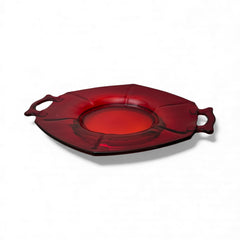 Vintage Imperial Glass Ruby Red Molly serving dish with hexagonal shape, twin handles, and low footed base, shown in various lighting to highlight its translucent red pressed glass and geometric design.