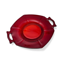 Vintage Imperial Glass Ruby Red Molly serving dish with hexagonal shape, twin handles, and low footed base, shown in various lighting to highlight its translucent red pressed glass and geometric design.