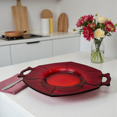 Vintage Imperial Glass Ruby Red Molly serving dish with hexagonal shape, twin handles, and low footed base, shown in various lighting to highlight its translucent red pressed glass and geometric design.