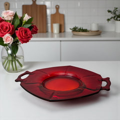 Vintage Imperial Glass Ruby Red Molly serving dish with hexagonal shape, twin handles, and low footed base, shown in various lighting to highlight its translucent red pressed glass and geometric design.