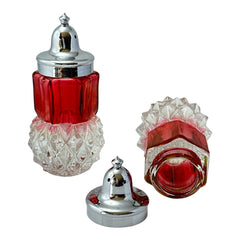 Pair of vintage Indiana Glass salt and pepper shakers featuring clear diamond point bases, paneled ruby red flash bands, and chrome-plated screw-on lids marked Made in Hong Kong. Mid-century design in excellent vintage condition.