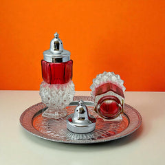 Pair of vintage Indiana Glass salt and pepper shakers featuring clear diamond point bases, paneled ruby red flash bands, and chrome-plated screw-on lids marked Made in Hong Kong. Mid-century design in excellent vintage condition.