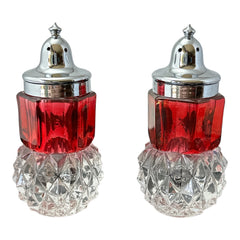Pair of vintage Indiana Glass salt and pepper shakers featuring clear diamond point bases, paneled ruby red flash bands, and chrome-plated screw-on lids marked Made in Hong Kong. Mid-century design in excellent vintage condition.