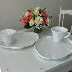  Vintage Indiana Glass Colony Harvest Grape milk glass snack plate and cup set from the 1960s, featuring embossed grapevine motifs and glossy white finish.
