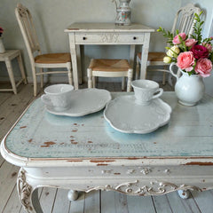  Vintage Indiana Glass Colony Harvest Grape milk glass snack plate and cup set from the 1960s, featuring embossed grapevine motifs and glossy white finish.
