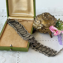 Vintage Italian Rome souvenir coin bracelet with silver‑tone medals of Colosseum, San Pietro, and she‑wolf, adjustable length.