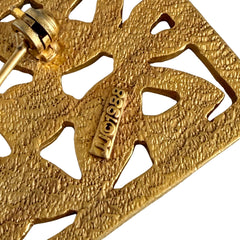 Vintage JJ Jonette brooch with interwoven Celtic knot design in gold‑tone metal, shown from various angles to display details and condition.