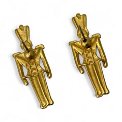 Gold tone vintage nutcracker earrings by JJ, featuring detailed toy soldier figures with tall hats and crossed arms; signed on the back with copyright symbol.