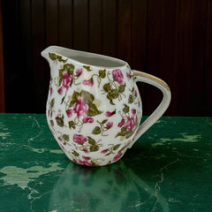 Vintage 1950s Japan porcelain creamer with pink chintz floral pattern, green leaves, and gold trim on rim and handle, marked Made in Japan