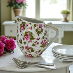 Vintage 1950s Japan porcelain creamer with pink chintz floral pattern, green leaves, and gold trim on rim and handle, marked Made in Japan