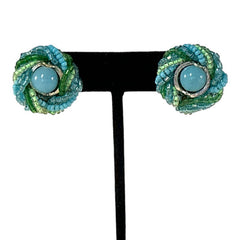 Vintage 1950s Japan clip-on earrings with turquoise bead center, green and turquoise seed beads, and silver tone ring.