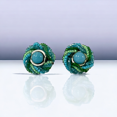 Vintage 1950s Japan clip-on earrings with turquoise bead center, green and turquoise seed beads, and silver tone ring.