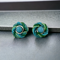 Vintage 1950s Japan clip-on earrings with turquoise bead center, green and turquoise seed beads, and silver tone ring.