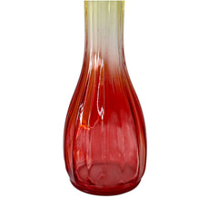 Vintage Jeannette Glass vase with ombre Amberina coloring and fluted design, styled with complementary flowers and soft lighting to highlight its texture, color gradient, and collectible charm.