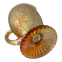 Vintage Jeannette marigold carnival glass pitcher with irises and herringbone pattern, ideal for sustainable home decor or serving drinks in eco-conscious style.