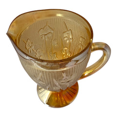 Vintage Jeannette marigold carnival glass pitcher with irises and herringbone pattern, ideal for sustainable home decor or serving drinks in eco-conscious style.