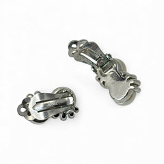 Vintage Jomaz clip-on earrings featuring two cream faux pearls accented with clear rhinestones in a silver-tone setting, signed on the back, shown in very good condition.