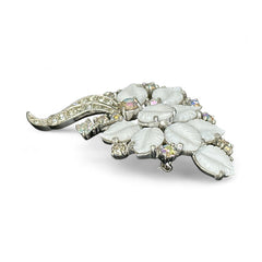 Vintage Jomaz floral spray brooch with molded milk glass leaves and aurora borealis rhinestones in silver tone setting, signed on reverse—1950s mid-century costume jewelry in excellent condition.