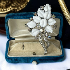 Vintage Jomaz floral spray brooch with molded milk glass leaves and aurora borealis rhinestones in silver tone setting, signed on reverse—1950s mid-century costume jewelry in excellent condition.
