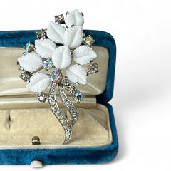 Vintage Jomaz floral spray brooch with molded milk glass leaves and aurora borealis rhinestones in silver tone setting, signed on reverse—1950s mid-century costume jewelry in excellent condition.