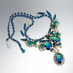 Vintage Juliana necklace with blue heliotrope oval stones and blue, green, and AB rhinestones in a silver‑tone setting.