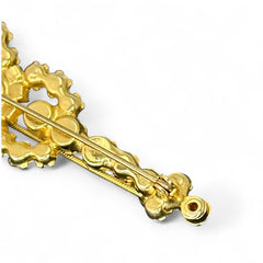 Vintage Juliana violin brooch in gold tone metal with green and peridot rhinestones, featuring layered construction and floral accents; verified design #3151 from the 1960s, shown from front and back.