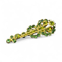Vintage Juliana violin brooch in gold tone metal with green and peridot rhinestones, featuring layered construction and floral accents; verified design #3151 from the 1960s, shown from front and back.
